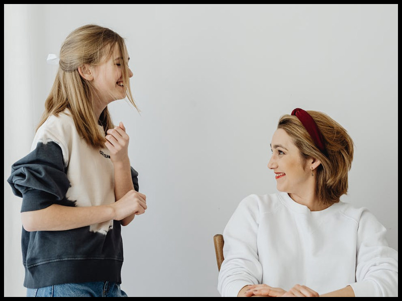 mother talking to daughter